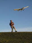 SX22361 Richard with RC plane lifting off.jpg